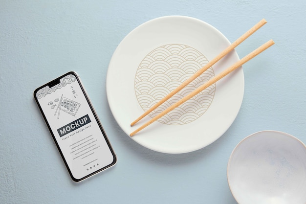 Tableware arrangement with mock-up smartphone