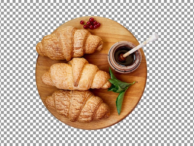 PSD croissant gustosi e croccanti con salsa su una tavola di legno con sfondo trasparente