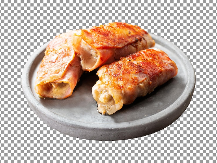 PSD tasty fried bacon and mushroom rolls on plate with transparent background