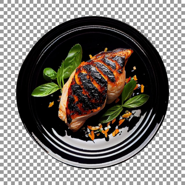 Tasty grilled chicken piece on a black plate isolated with transparent background