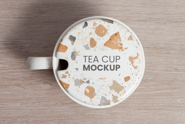 PSD tea cup with terrazzo texture on wooden backgroung