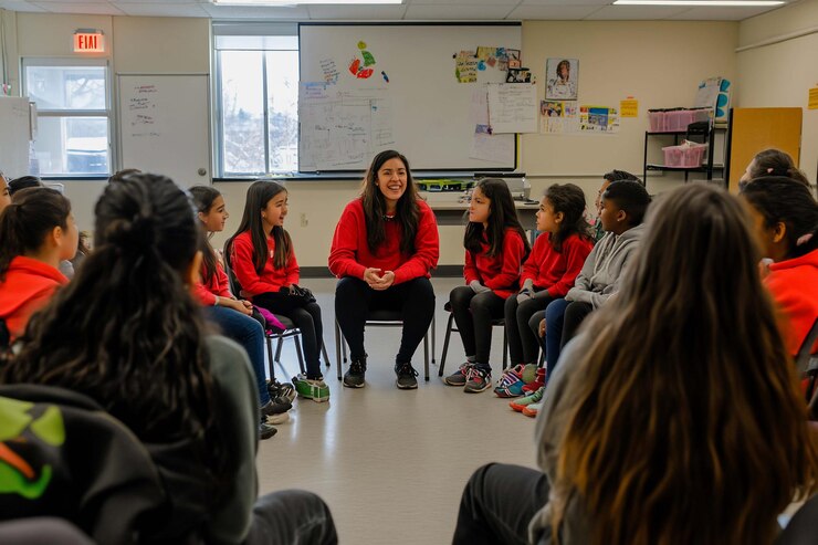 PSD teacher leading a circle discussion with elementary school students