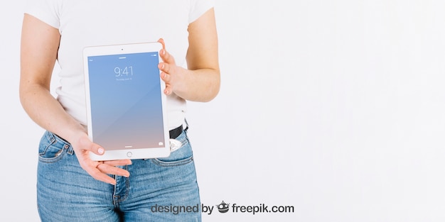 PSD technology mockup with woman holding tablet