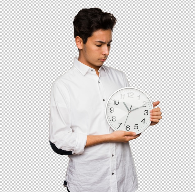 Teenager holding a big clock