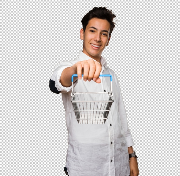 Teenager holding a shopping basket