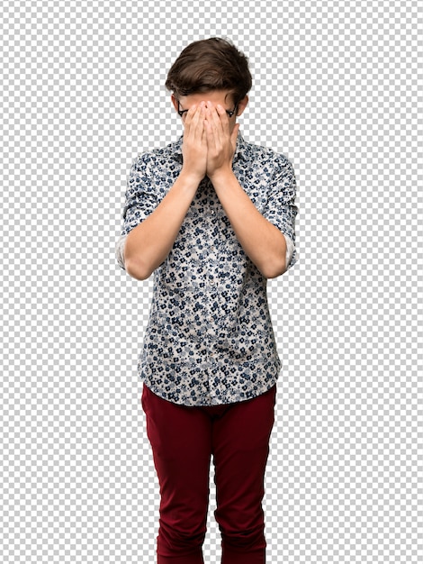 Teenager man with flower shirt and glasses with tired and sick expression