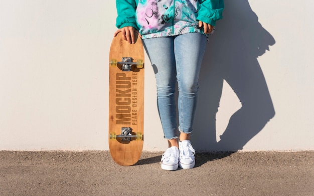 Teenager with mock-up skateboard outdoors