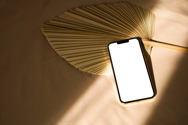 PSD telefoonmodel met zonlichtschaduwen en droog palmblad