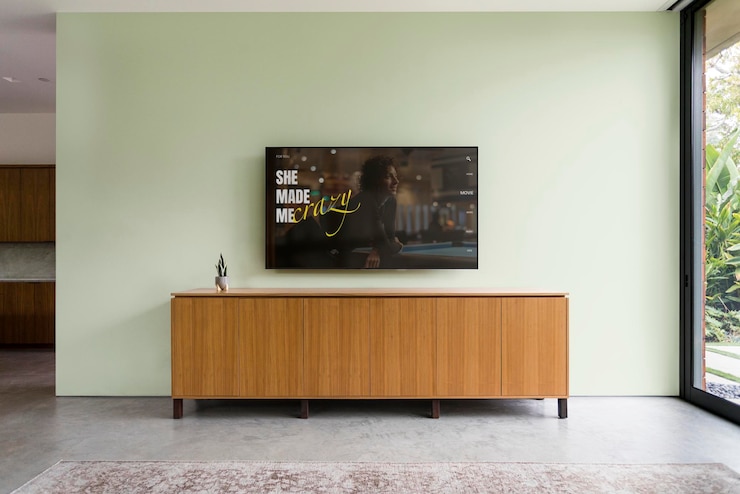 PSD television mockup on living room wall psd
