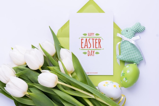 Template for Easter greeting card Blank card with an envelope and bouquet of white tulips