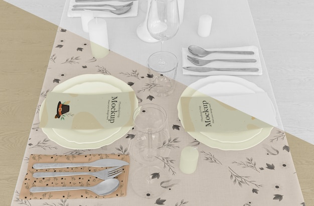 Thanksgiving dinner table arrangement with cutlery and plates