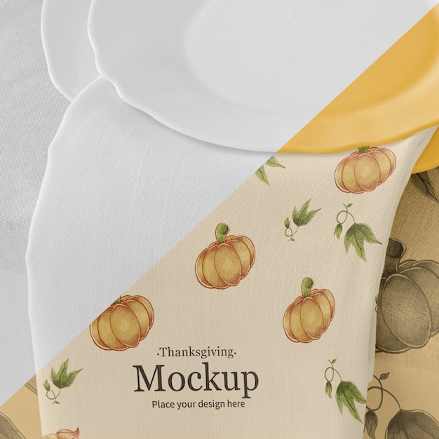 Thanksgiving dinner table arrangement with plates and napkin