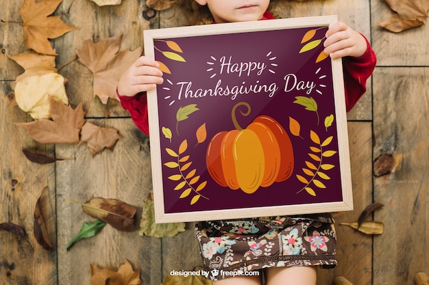 Thanksgiving mockup with girl holding frame