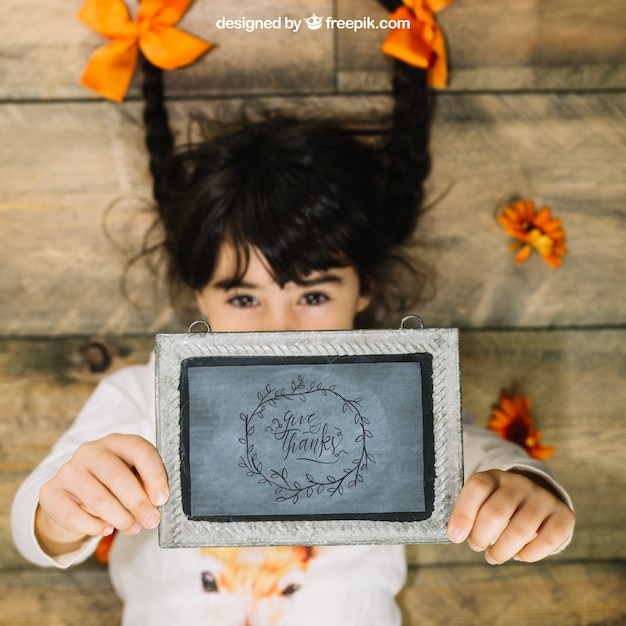 PSD thanksgiving mockup with girl holding slate