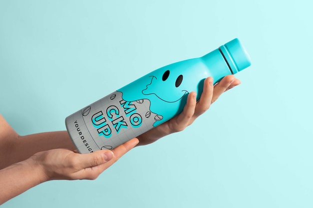 PSD thermo bottle mockup held in hand