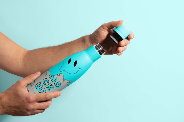 Thermo bottle mockup held in hand