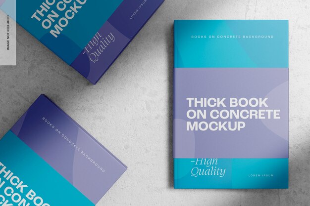 Thick books on concrete mockup, top view