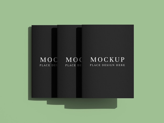 three black book cover mockups on light green background front cover showcase