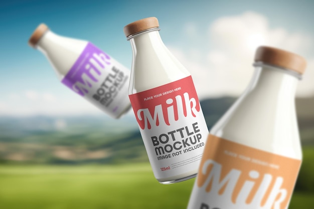 Three bottles of milk are in a field with a sky background.