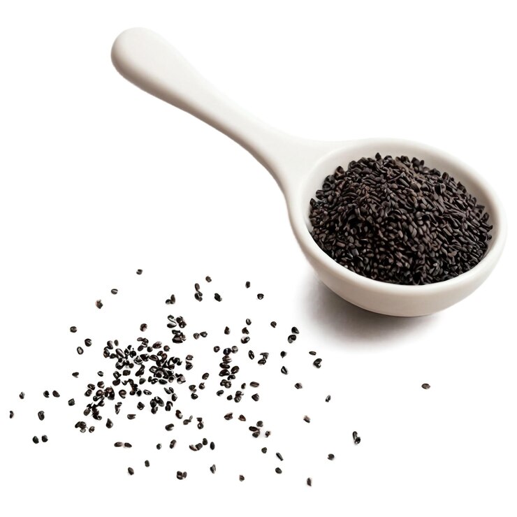 PSD toasted nigella seeds in a small porcelain cup isolated on transparent background