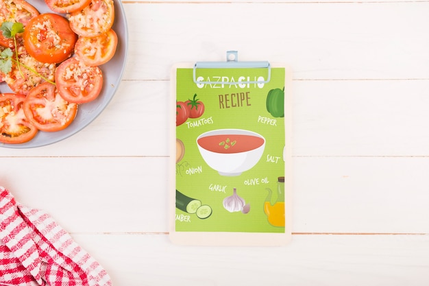 Tomatoes on plate and clipboard