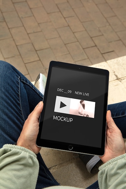 Top view adult relaxing with tablet mockup