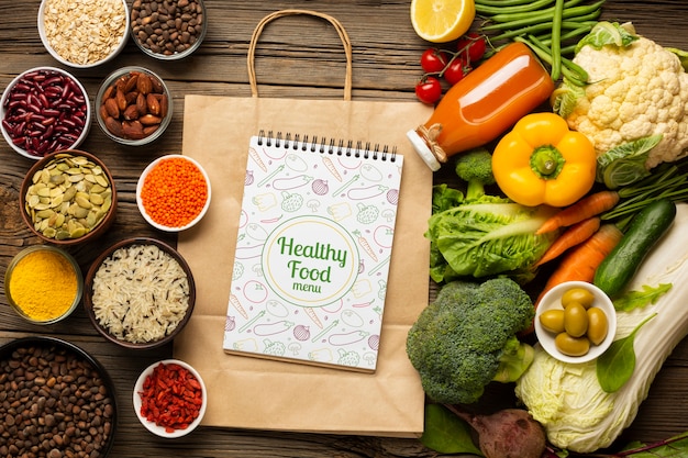 Top view arrangement of healthy organic food and paper bags