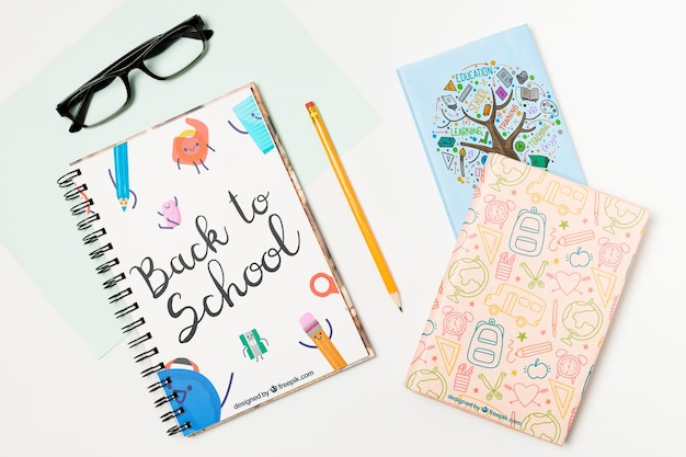top view arrangement with glasses and notebooks