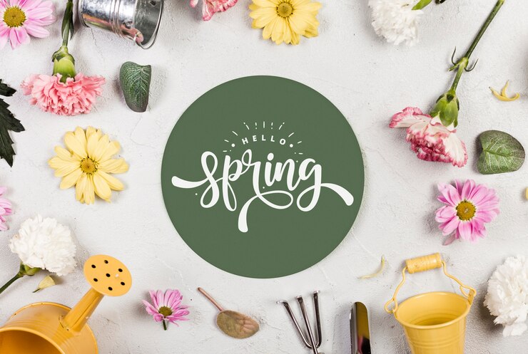 PSD top view of assortment of spring flowers and gardening tools