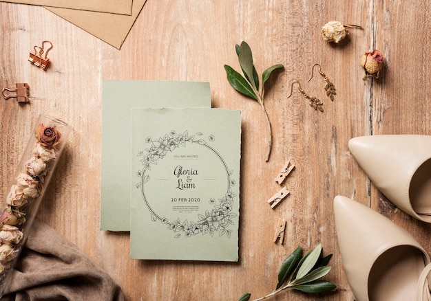 PSD top view beautiful assortment of wedding elements with card mock-up