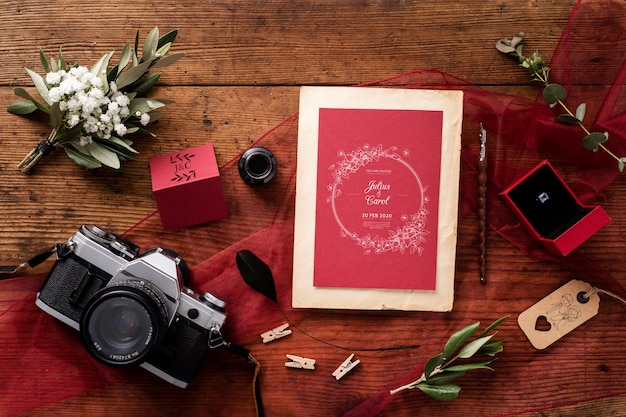 PSD top view beautiful composition of wedding elements with card mock-up