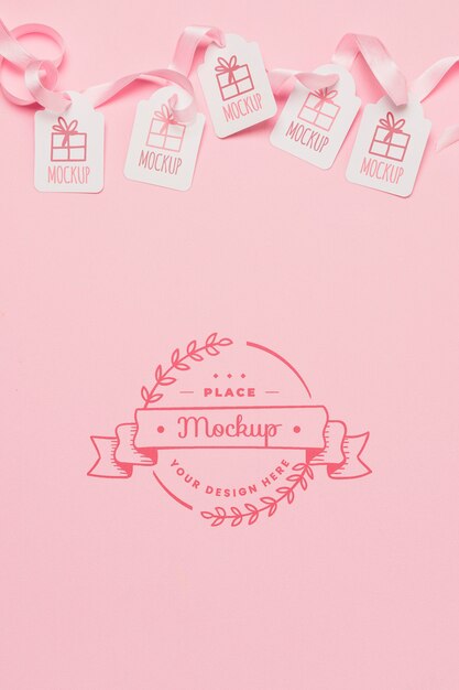 Top view birthday gift tags mock-ups with pink ribbons