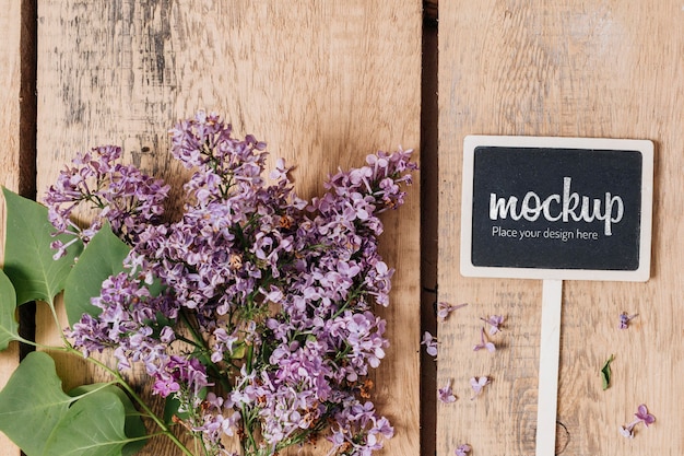 Top view blackboard mock-up with beautiful flowers