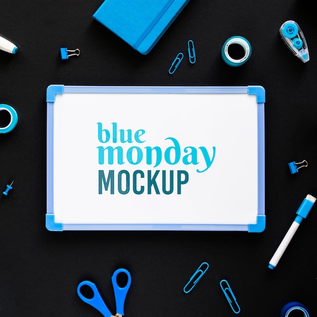 Top view of blue monday whiteboard with stationery