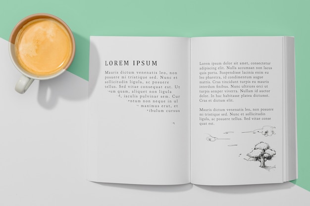 PSD top view book mock-up with coffee