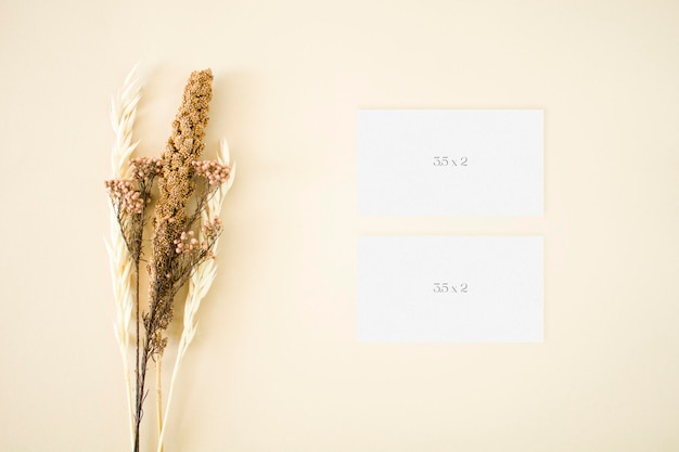 Top view botanical business cards mockup with flowers