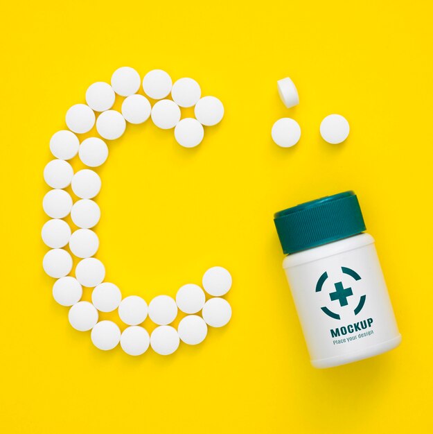 Top view of bottle with pills in shape of c