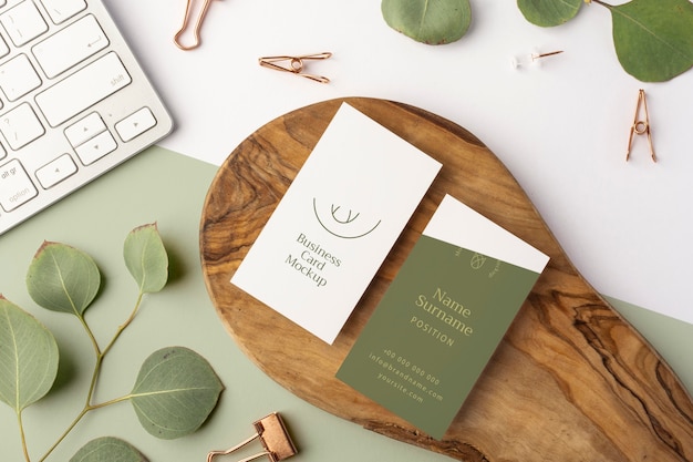 top view business cards on wood and keybaord