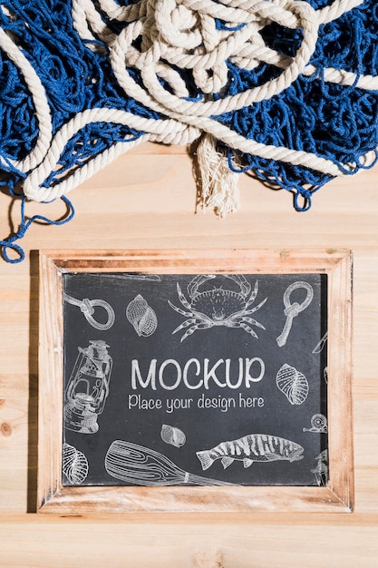 Top view of chalkboard with fishing net