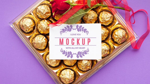 Top view chocolate and rose mock-up