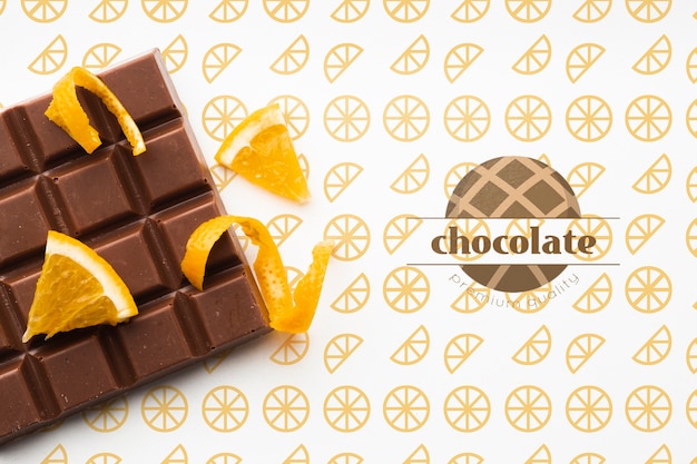 PSD top view chocolate with orange background mock-up