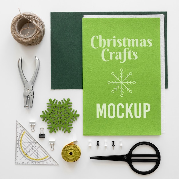 Top view of christmas crafts with scissors and measuring tape