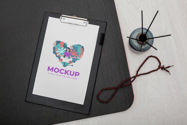 top view clipboard and yoga mat