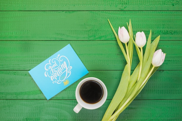 Top view collection of coffee cup next to flowers