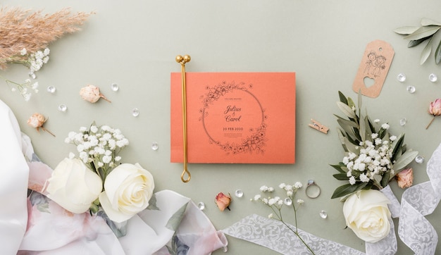 Top view composition of wedding elements with card mock-up