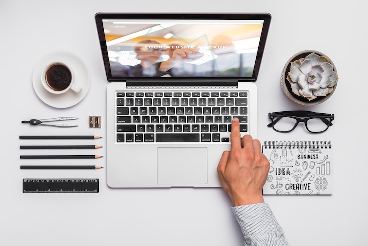 PSD top view composition with laptop and office supplies