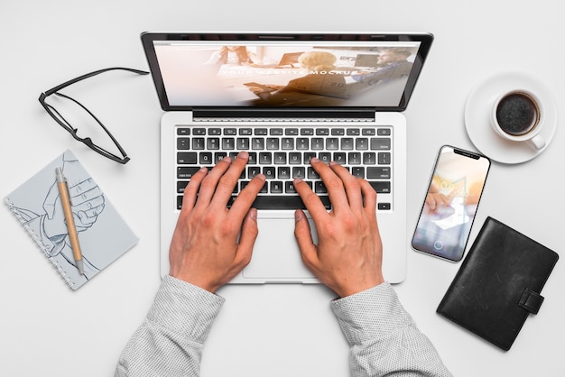 top view composition with laptop and office supplies