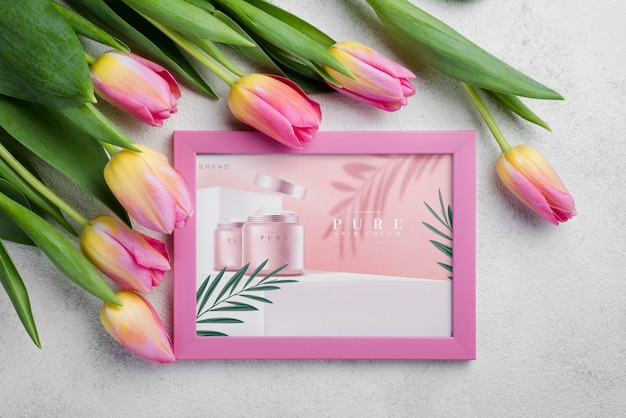 Top view cosmetics mockup with flowers