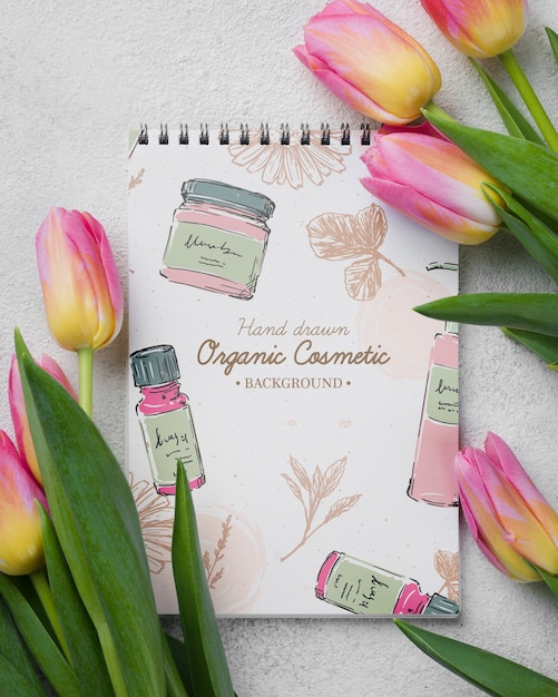 Top view cosmetics mockup with flowers