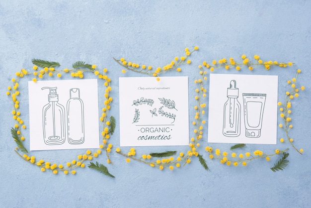 top view cosmetics mockup with flowers
